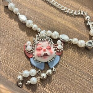 Unique Silver and Pearl Necklace with Artistic Pendant